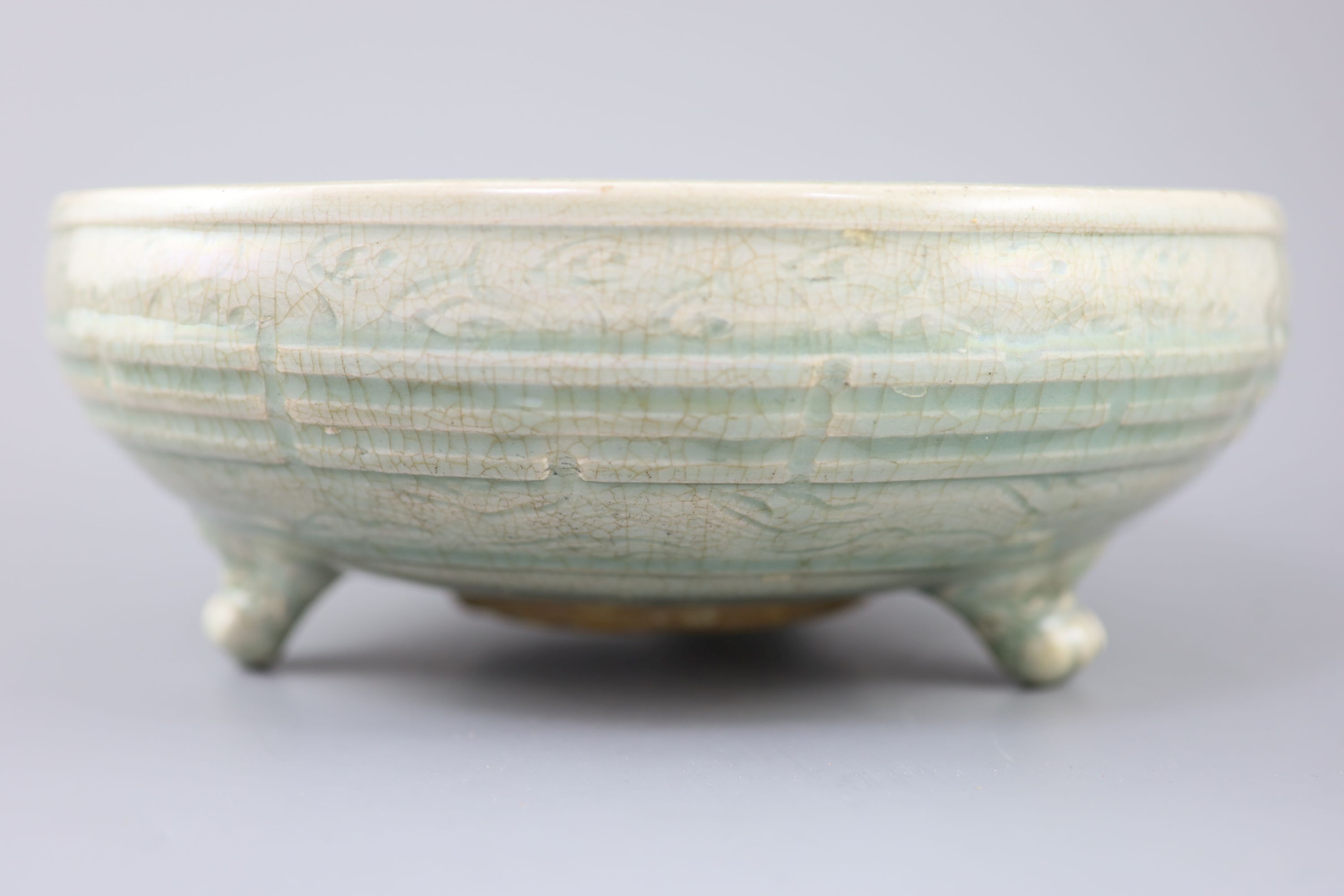 A large Chinese Longquan celadon tripod censer, Ming dynasty, 15th century, 31cm diameter